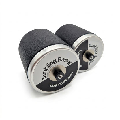 Two black and silver tumbling barrels with 'Tumbling Barrel' branding on a white background.